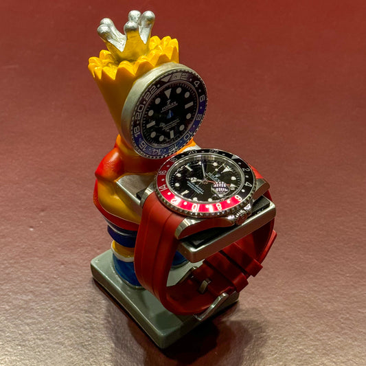 Yellow diver watch holder displaying a GMT watch with black and red bezel – Artisan Watch Co.