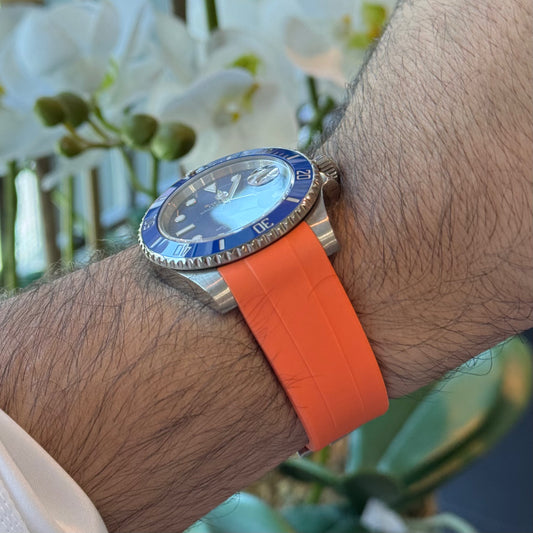 Orange curved rubber watch strap, side profile on the wrist – Artisan Watch Co.
