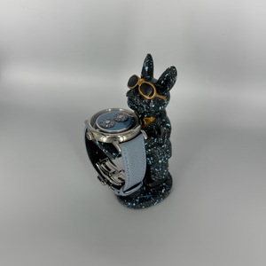 Galaxy Dog figurine watch holder with blue splatter finish and gold aviators, displaying a watch on its arm – Artisan Watch Co.
