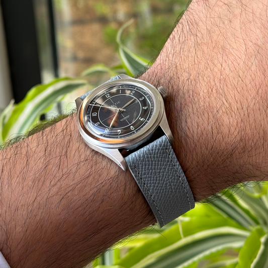 Grey Saffiano leather watch strap, angled view showing textured grain – Artisan Watch Co.