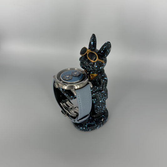Galaxy Dog figurine watch holder with blue splatter finish and gold aviators, displaying a watch on its arm – Artisan Watch Co.