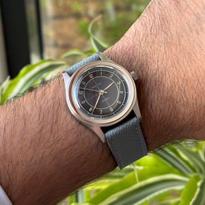 Grey Saffiano leather watch strap with tonal stitching, worn on wrist – Artisan Watch Co.